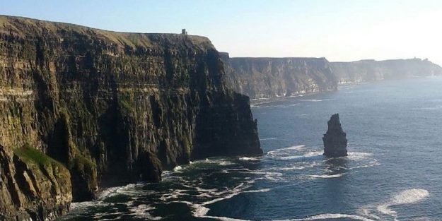 Scenic view of cliffs by the sea