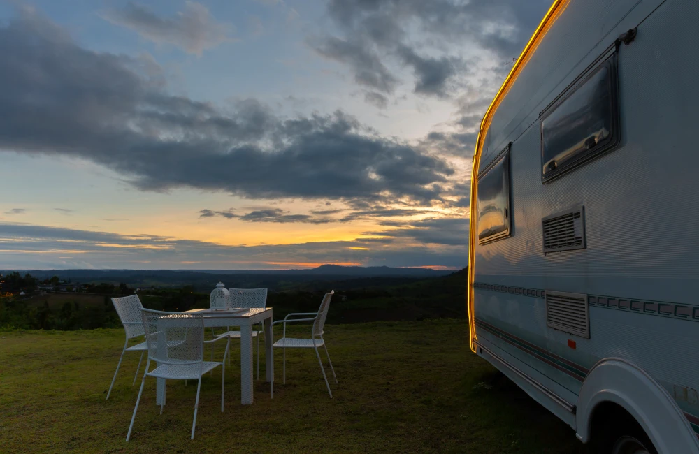 campsite with caravan dusk time